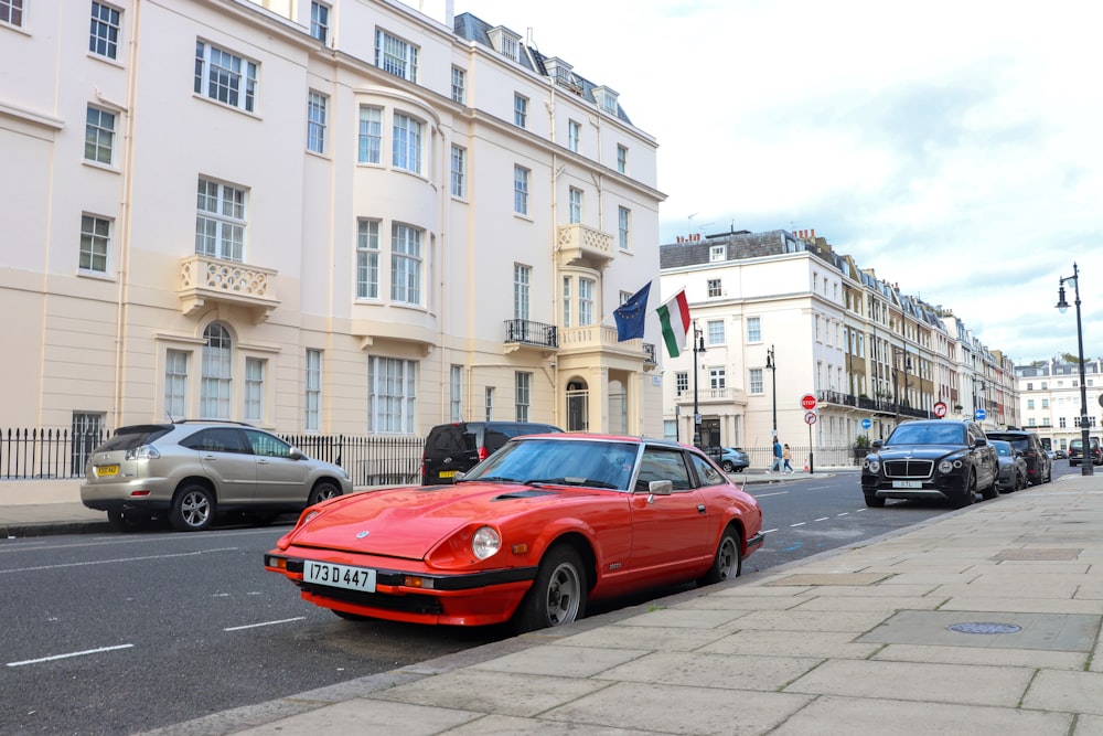 a red sports car parked on the side of a street