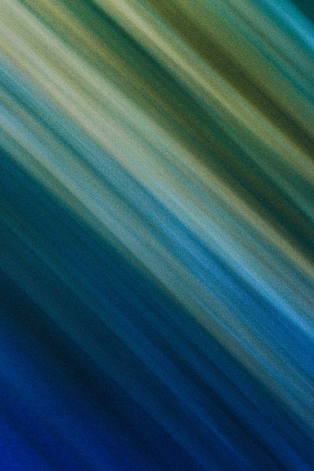 a blurry image of a blue and green background