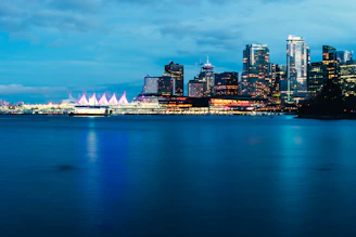 High-resolution photo of the Düsseldorf Medienhafen skyline at dusk with cool blue lighting.