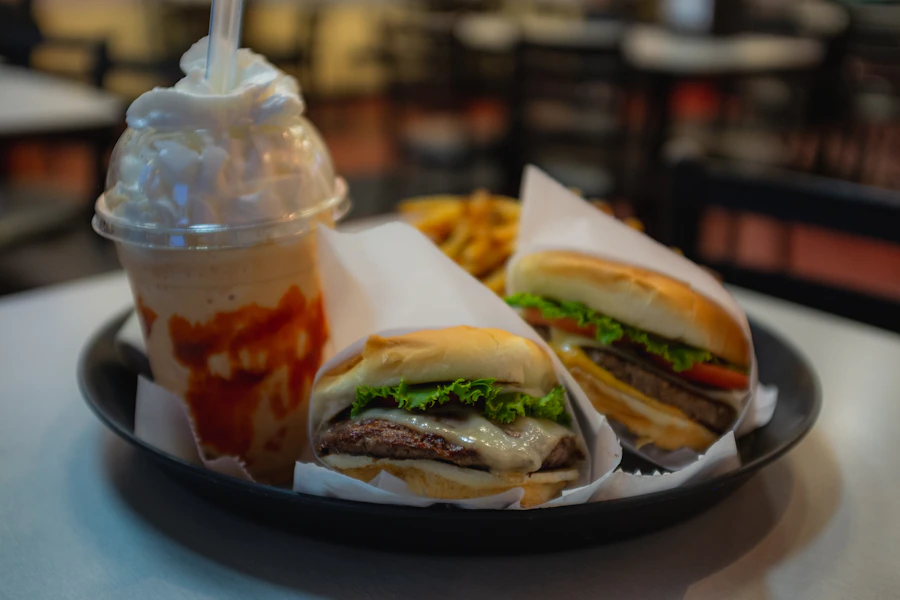 Burgers and fries on a restaurant tray