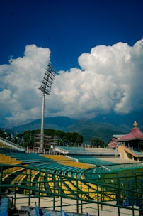 a baseball field with a tall metal pole