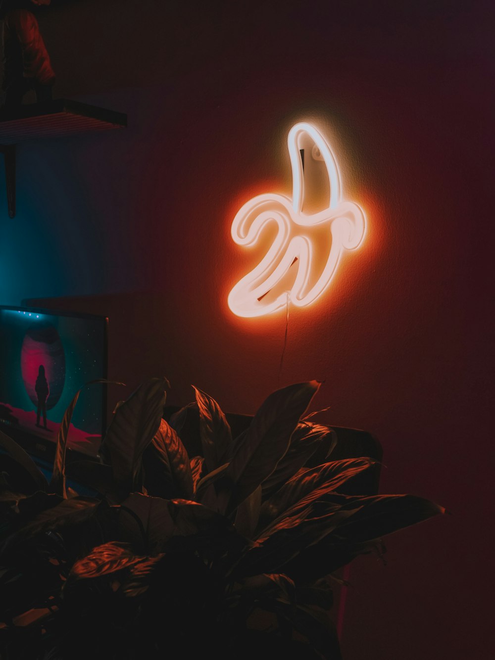 a neon sign hanging from the side of a wall