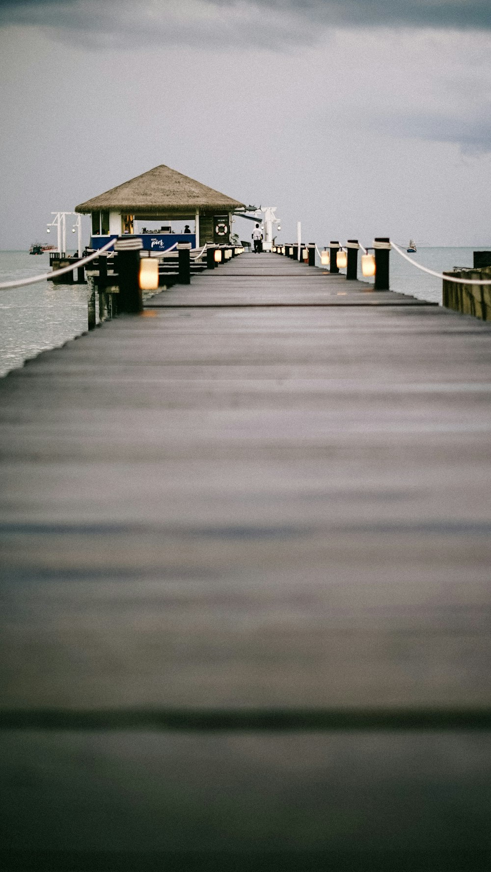 a pier with a car parked at the end of it