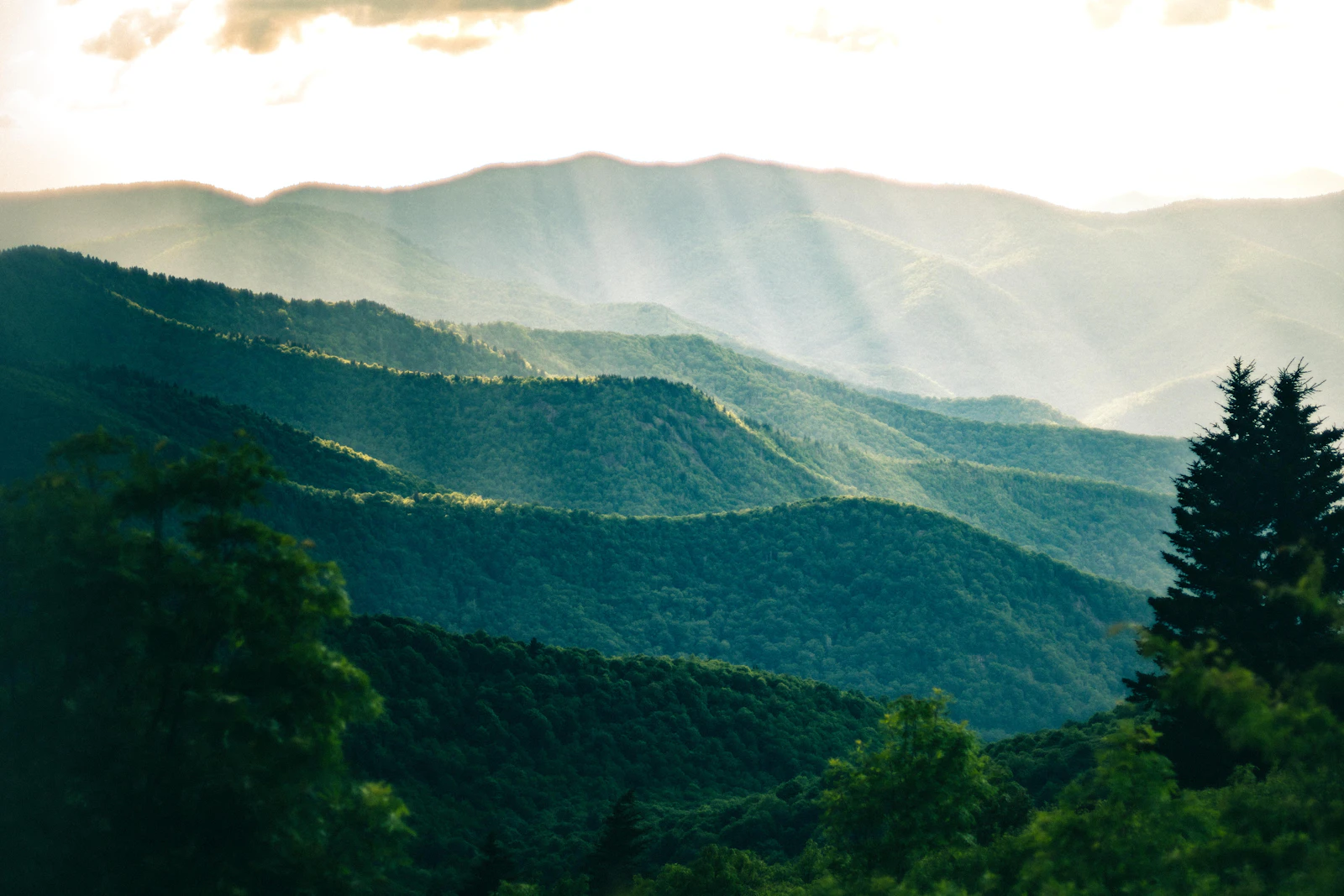Layered Appalachian ridges beneath broken cloud