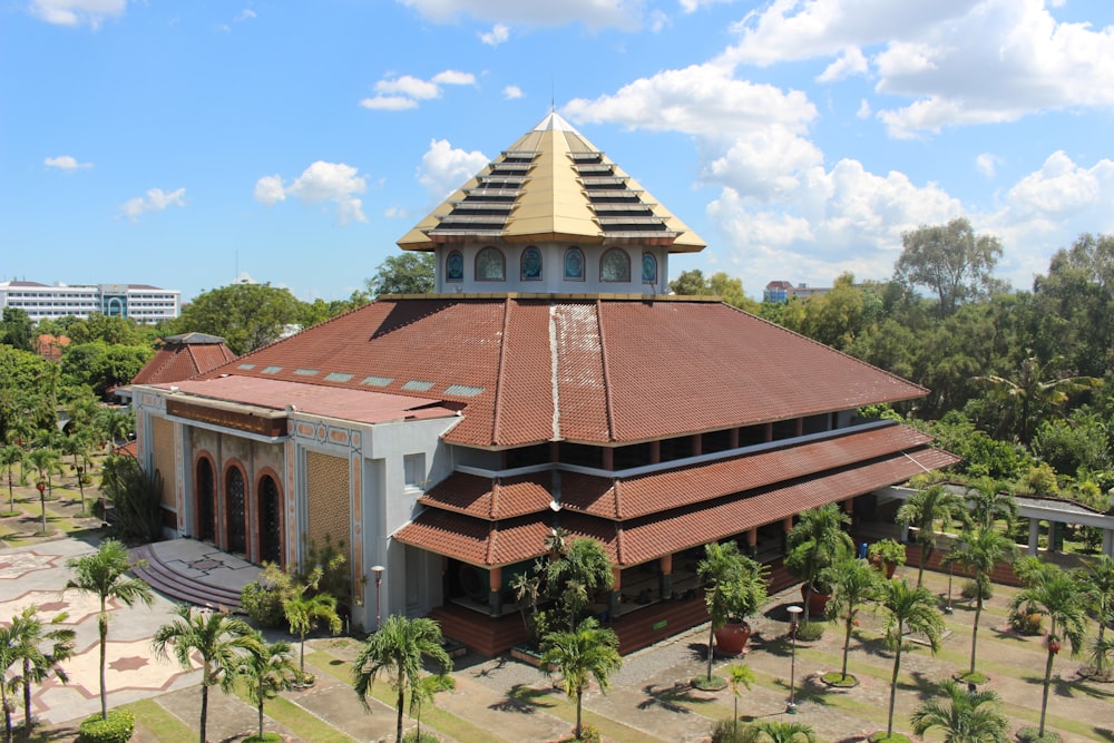 an aerial view of a building in a tropical area