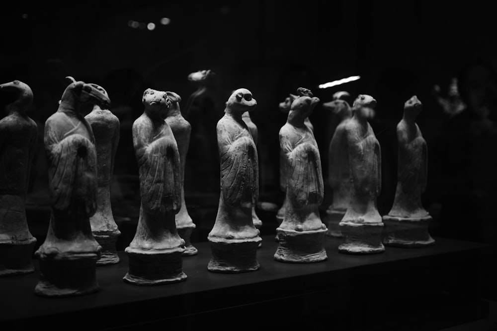a group of statues sitting on top of a table