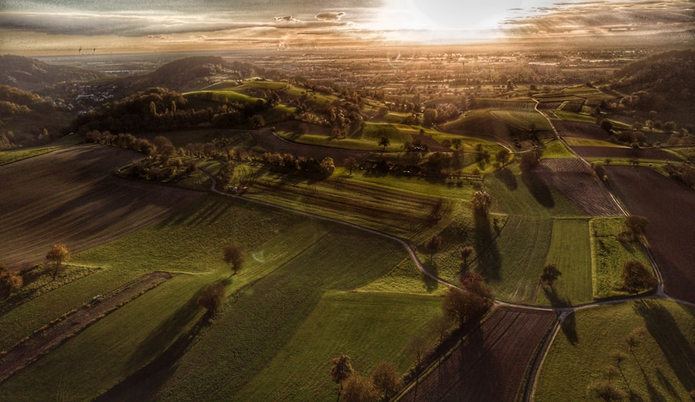 an aerial view of a rural area with trees and fields