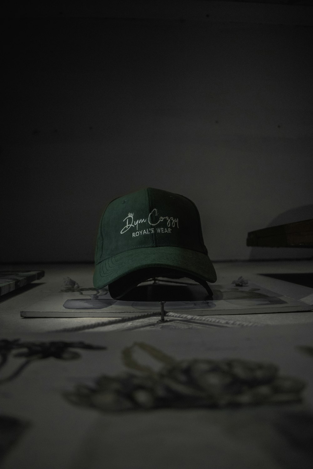 a green hat sitting on top of a table