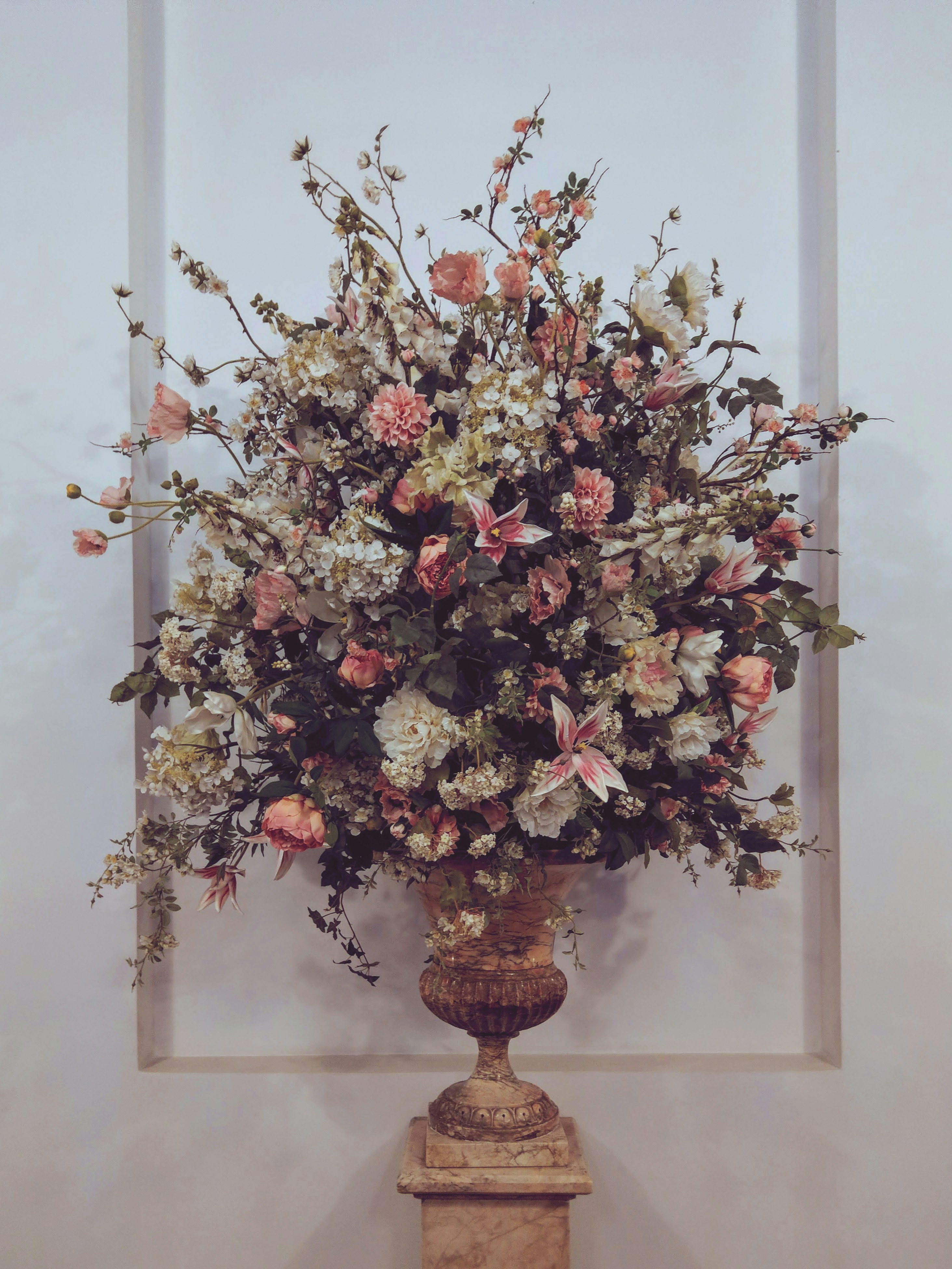 A vase filled with lots of flowers on top of a table photo – Free ...