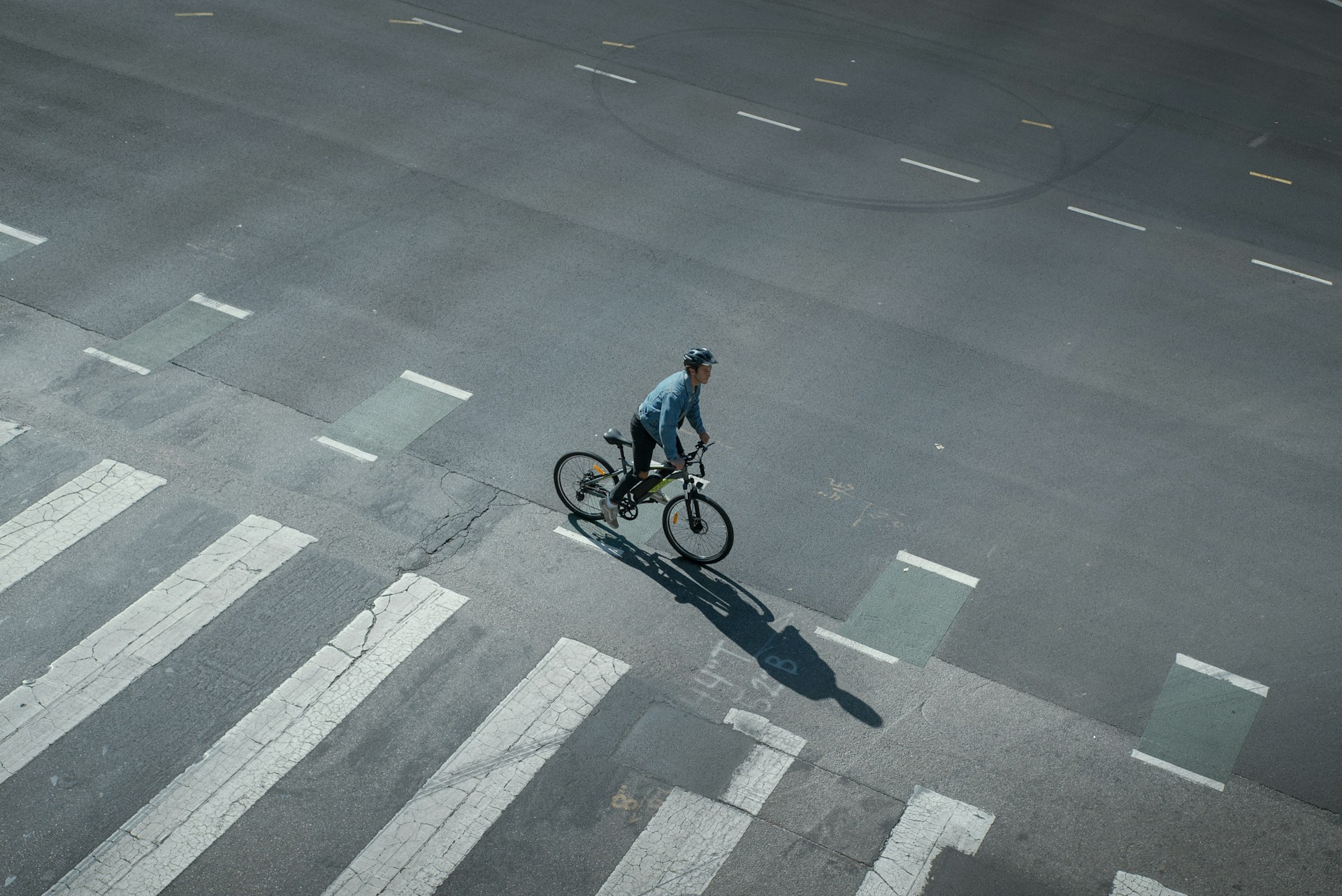 a man riding a bike down a street
