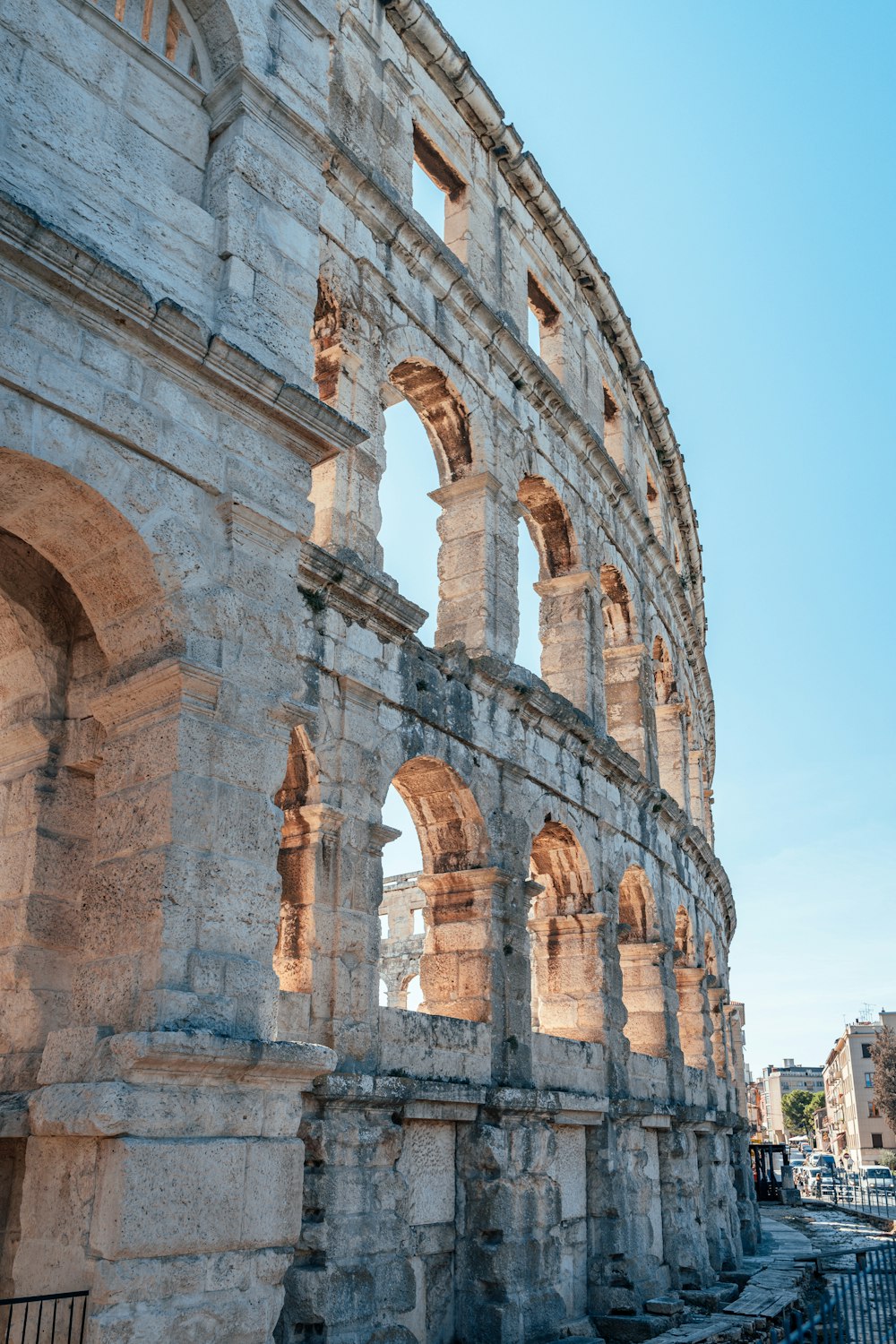 a large stone building with arches and windows