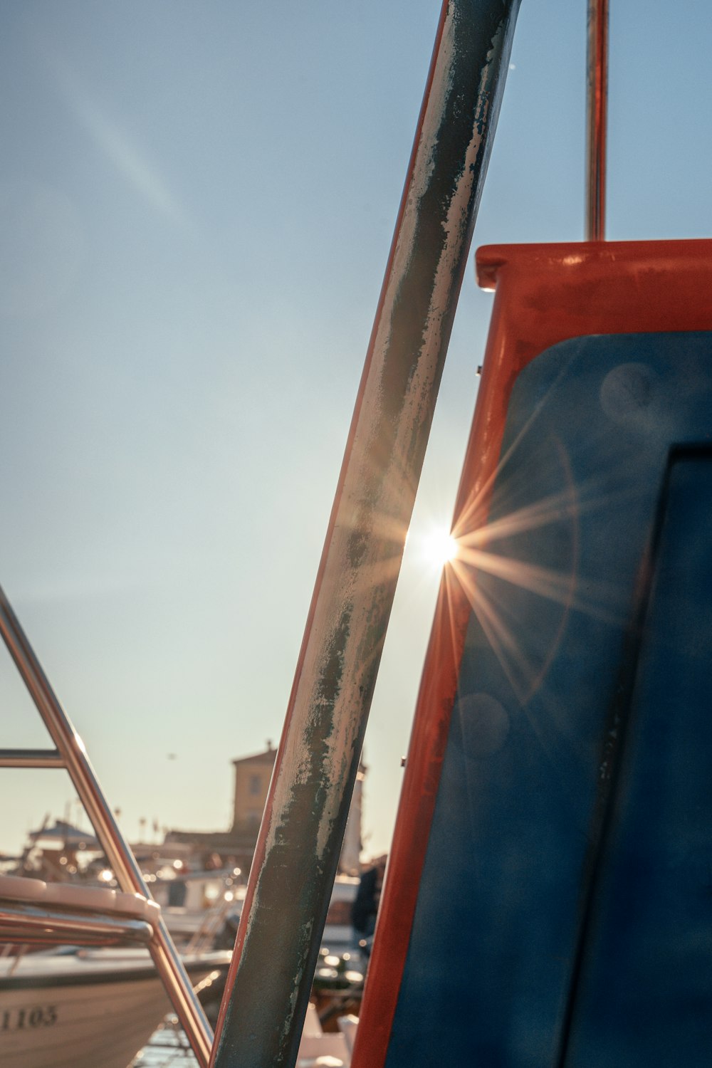 the sun shines brightly on a boat in the water