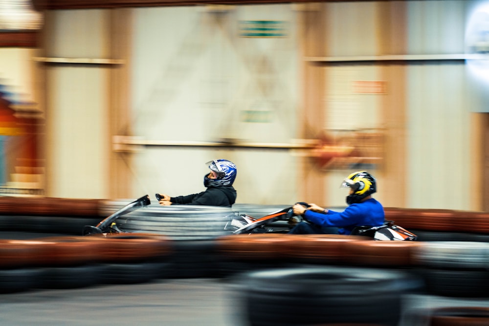 a blurry photo of two people on a motorcycle