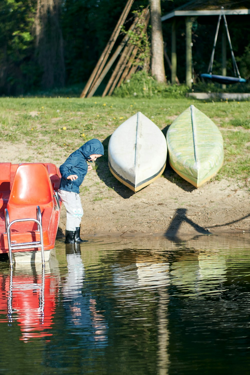 a man standing next to a body of water