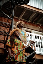 a couple of people that are standing on some stairs