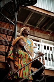 a couple of people that are standing on some stairs