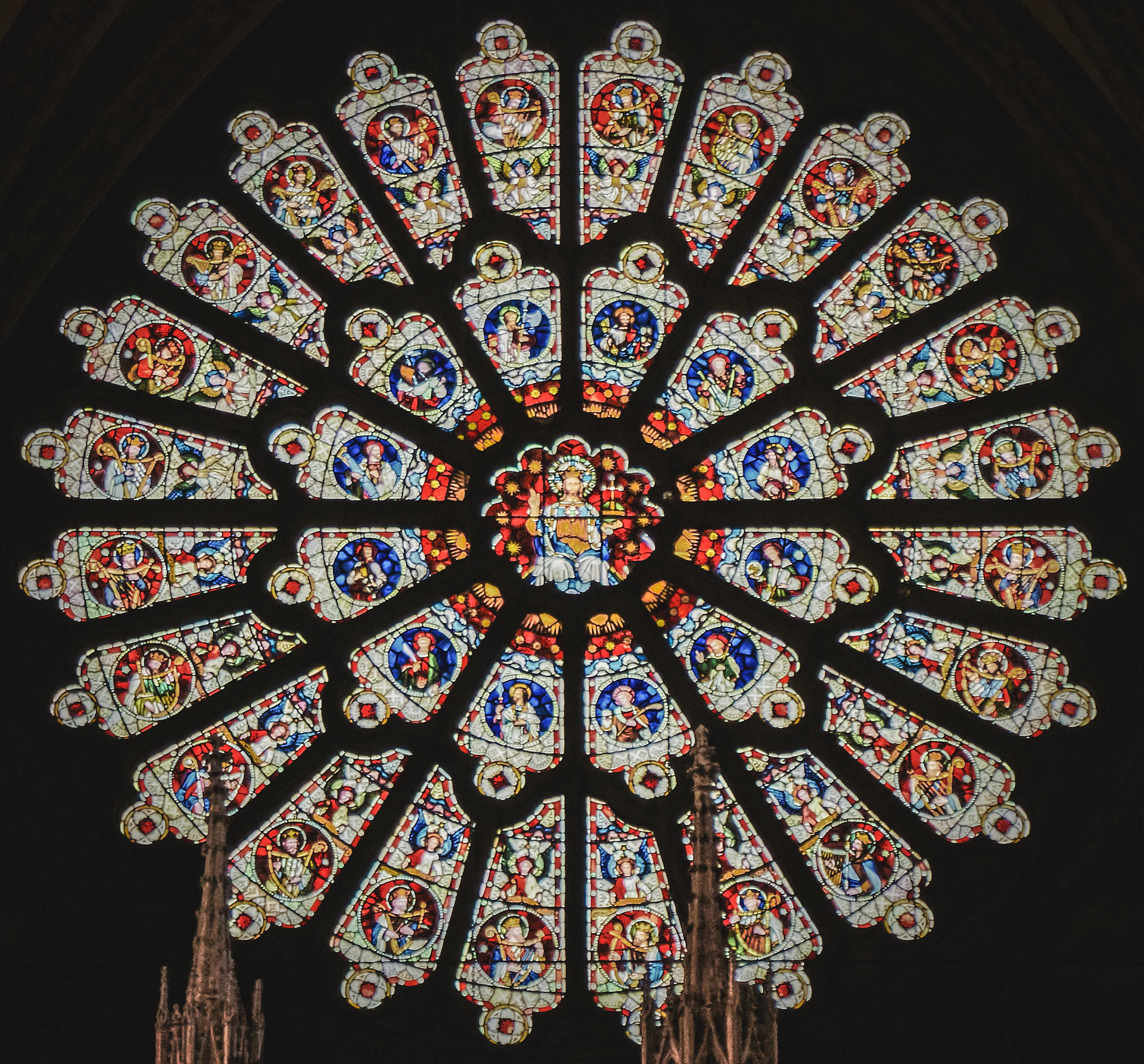 a large stained glass window in a cathedral