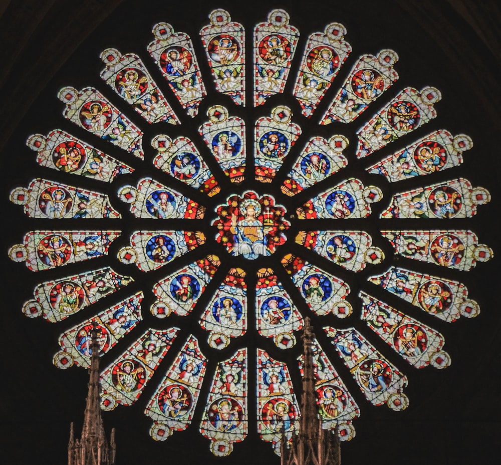 a large stained glass window in a cathedral