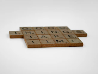 a couple of scrabble tiles sitting on top of a table