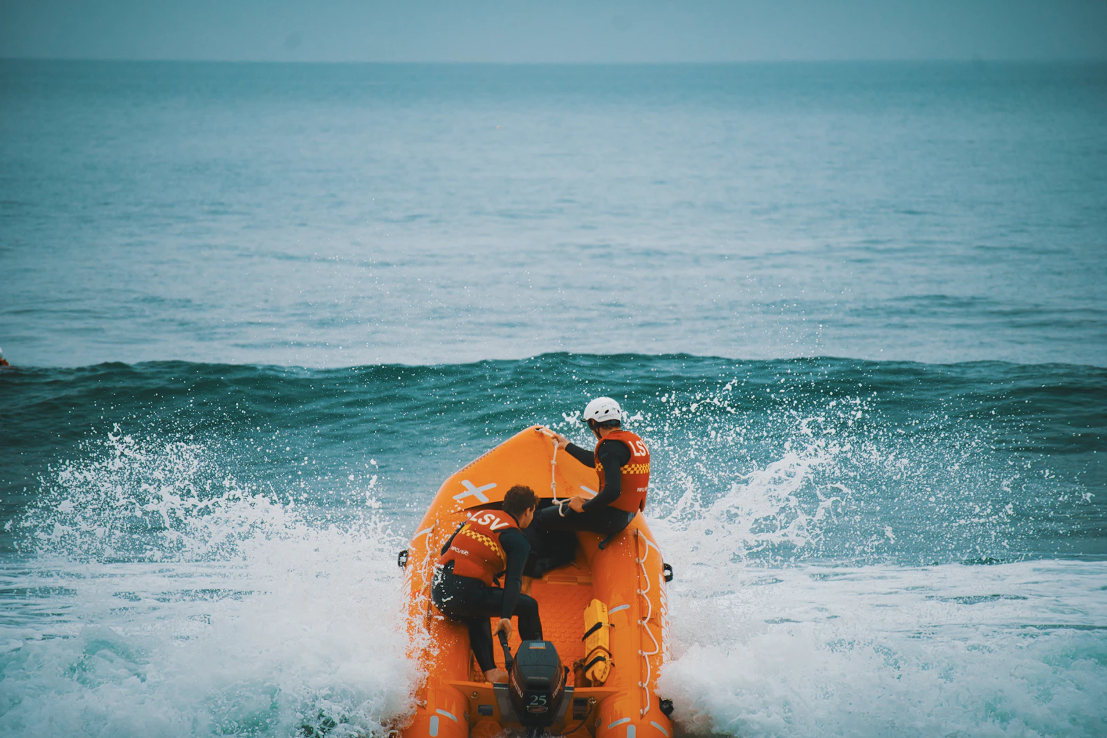 Two people on an orange raft i