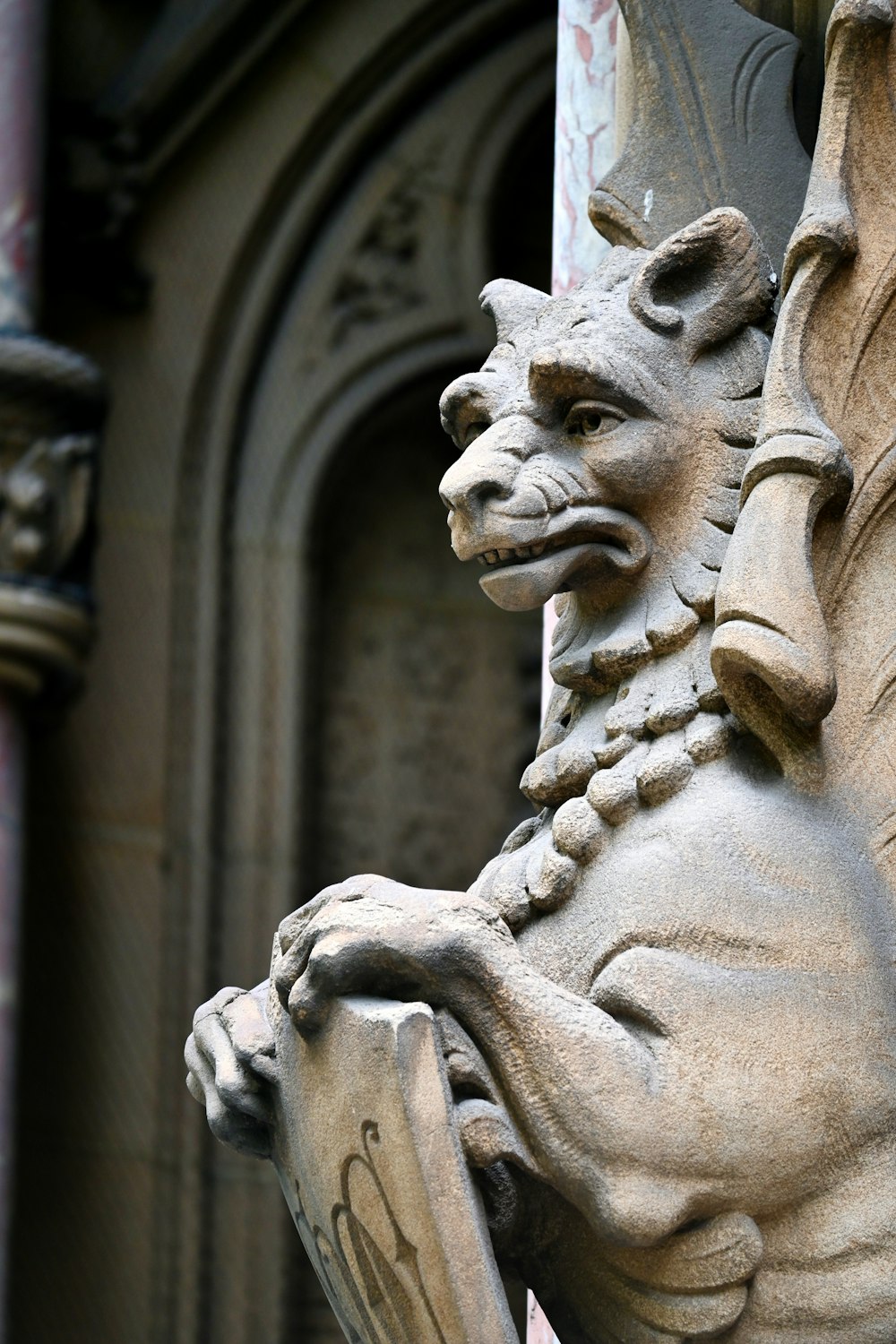 a gargoyle gargoyle on the side of a building