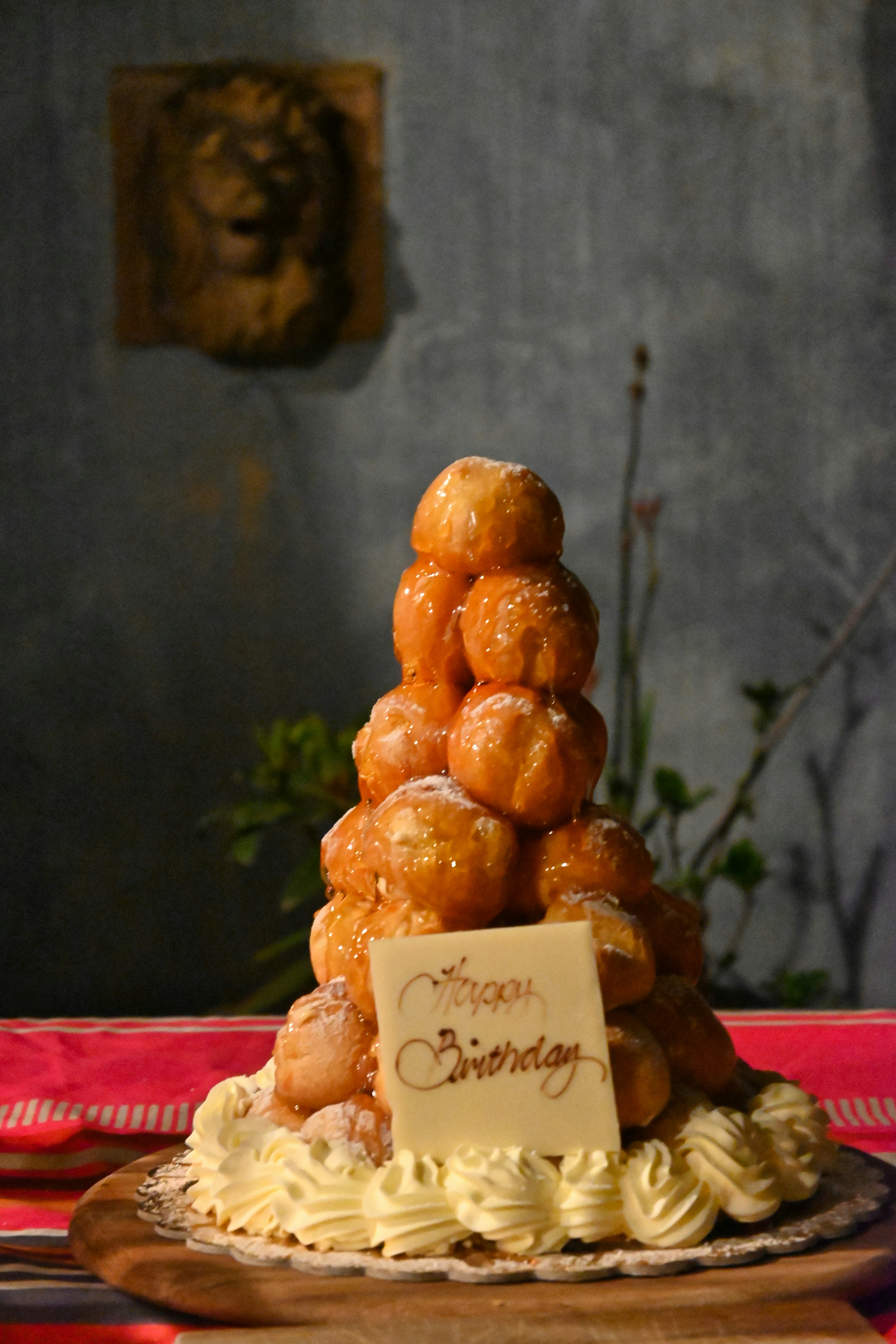 Birthday celebration pastry tower with decorative elements, festive presentation