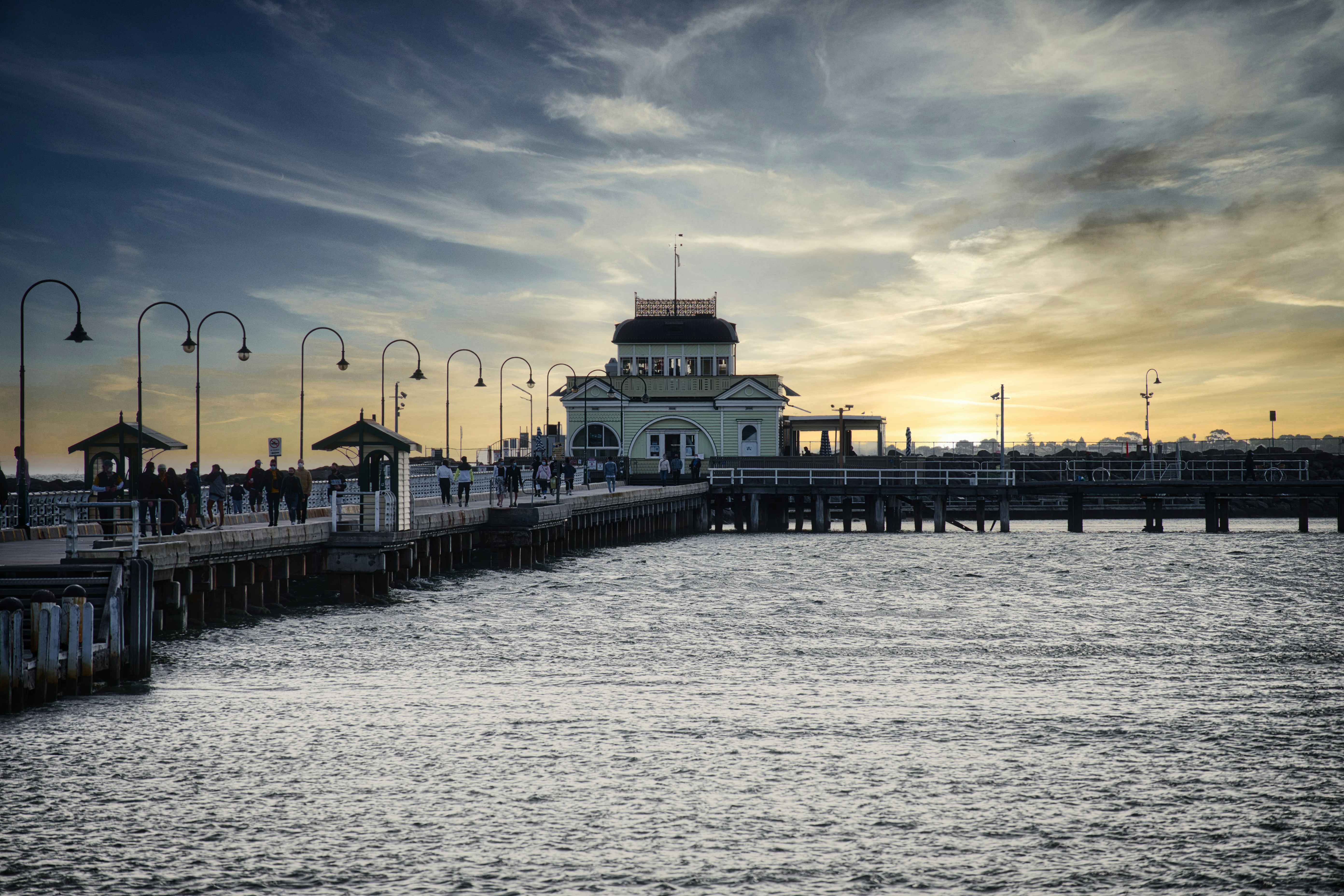 a large body of water next to a pier