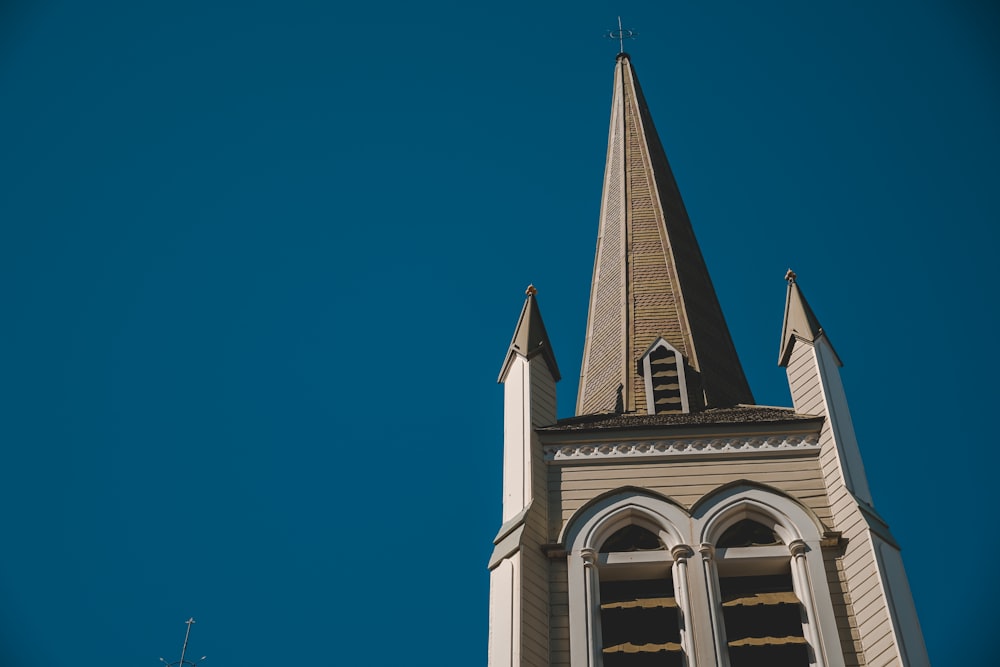 a church steeple with a clock on it