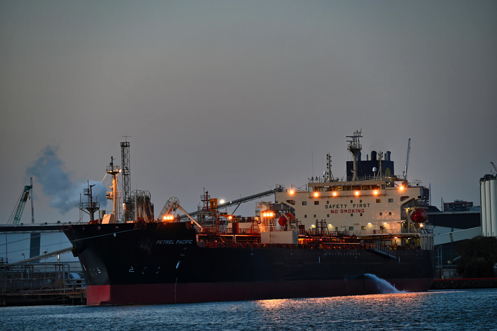 Tanker alongside a marine terminal at night