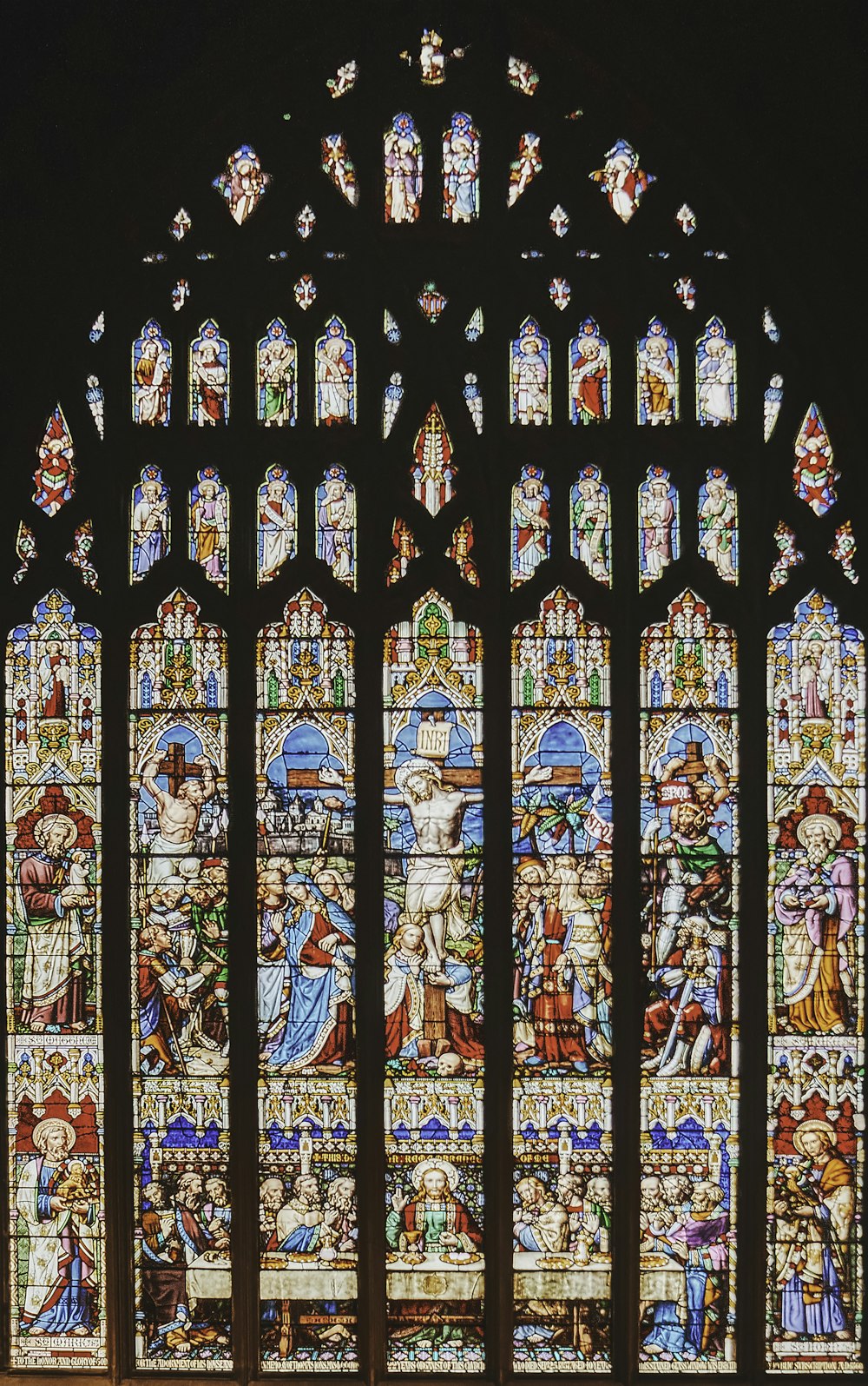 a large stained glass window in a church