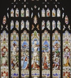 a large stained glass window in a church