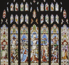 a large stained glass window in a church