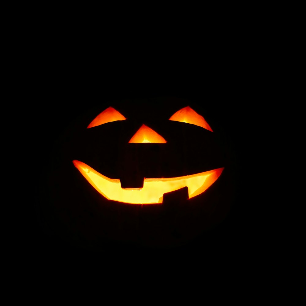 a carved jack o lantern in the dark