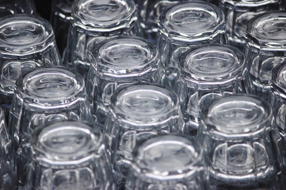 a close up of many clear glass jars