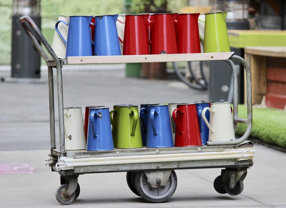 a cart with a bunch of cups on it
