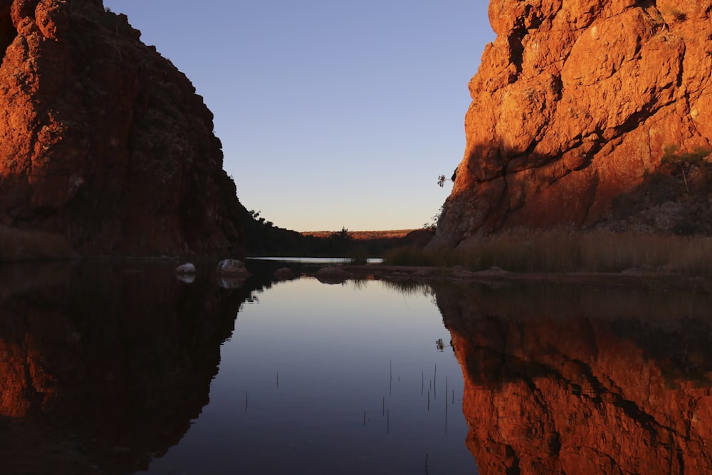 a body of water surrounded by large rocks