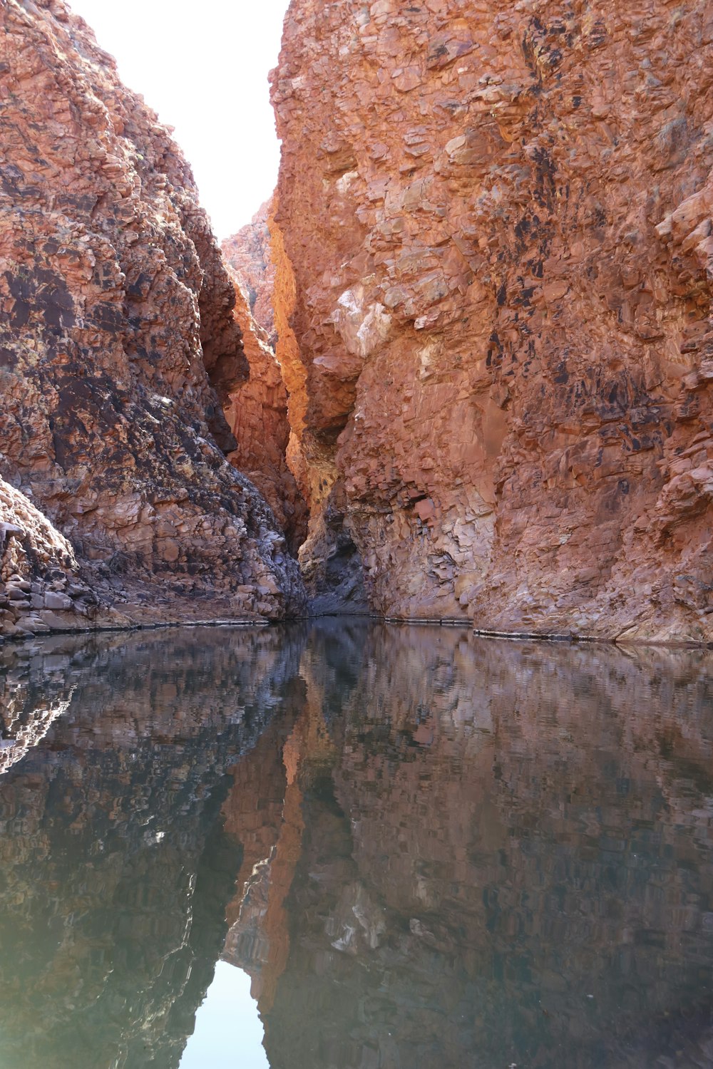 a body of water surrounded by large rocks