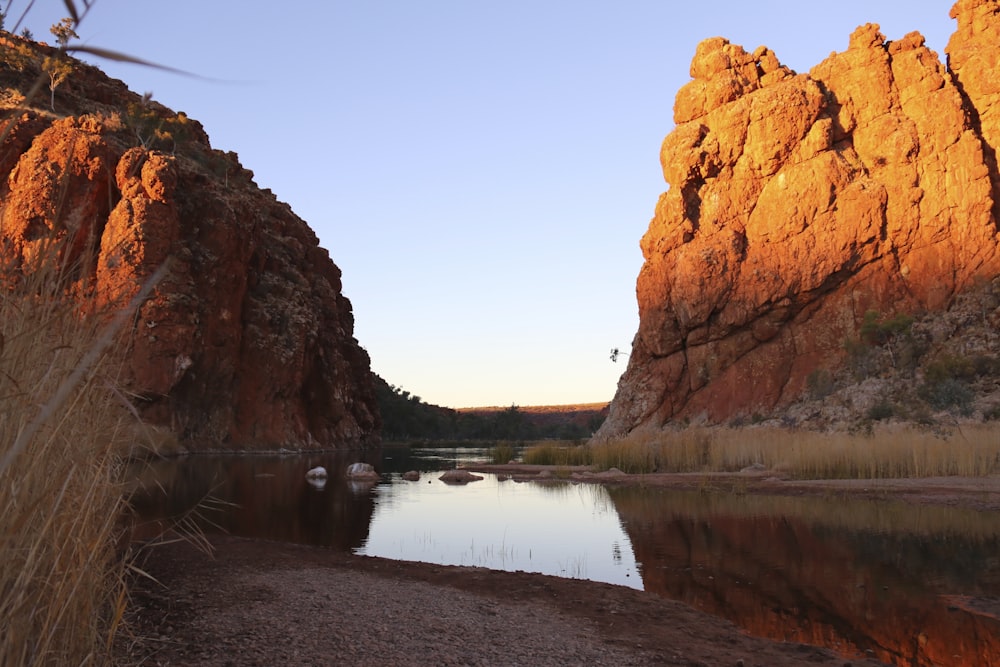 a body of water surrounded by large rocks