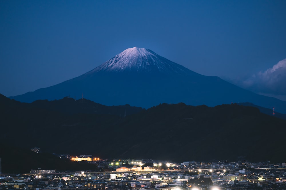 a view of a city with a mountain in the background