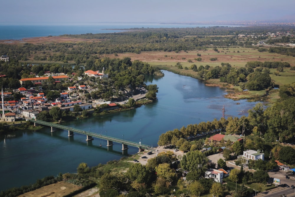 an aerial view of a river and a bridge