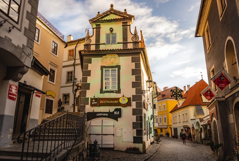 a cobblestone street lined with old buildings