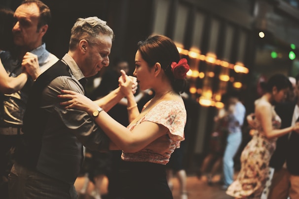 a couple of people that are dancing together