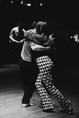 a couple of people that are on a dance floor