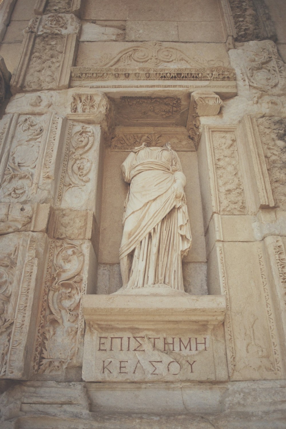 a statue on the side of a building