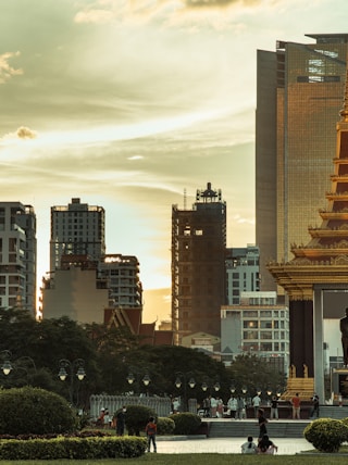 a city with tall buildings and a clock tower