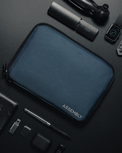 an assortment of electronics and accessories laid out on a table