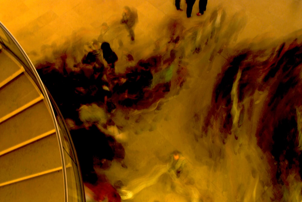 a group of people standing around a spiral staircase