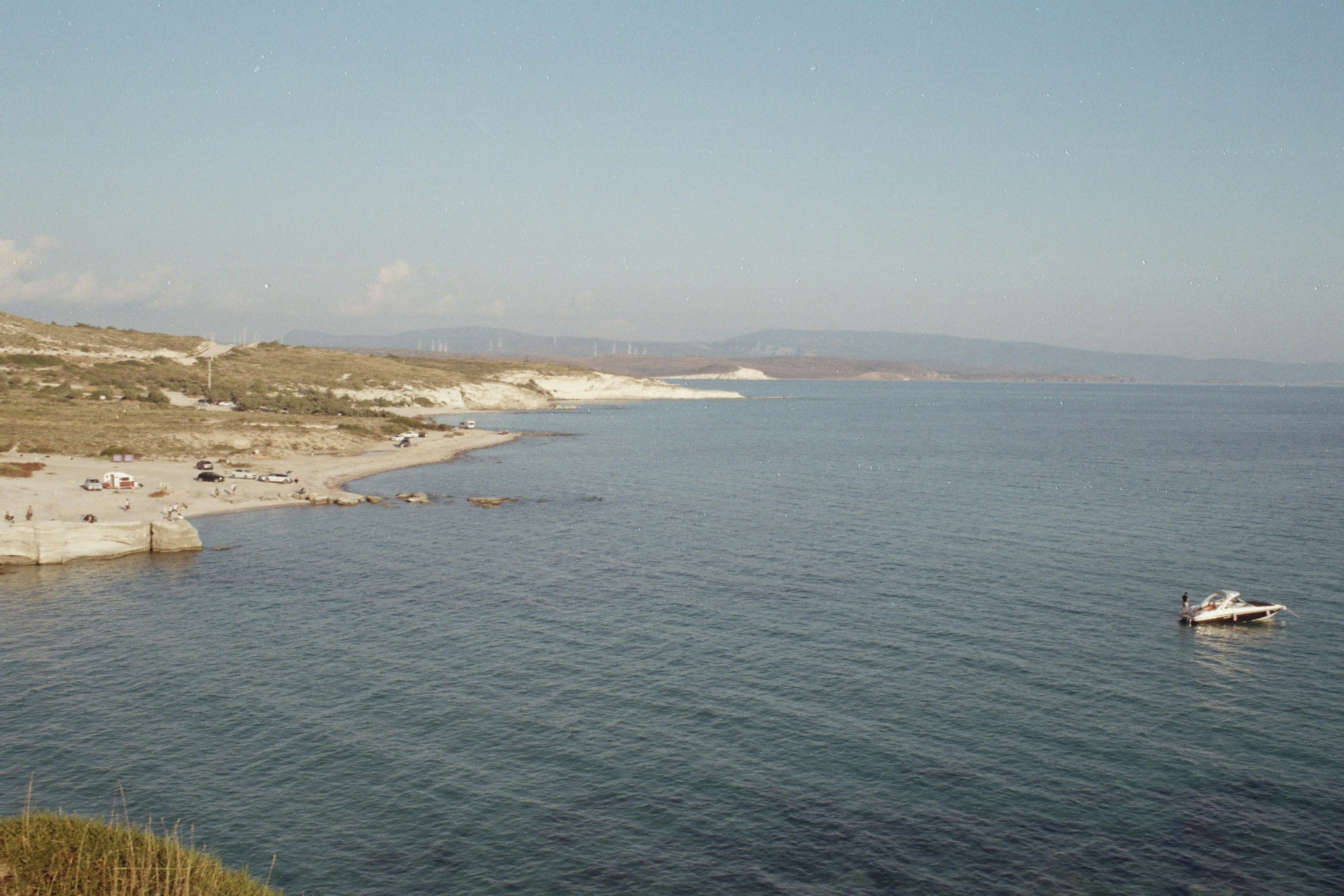 a boat floating on top of a large body of water