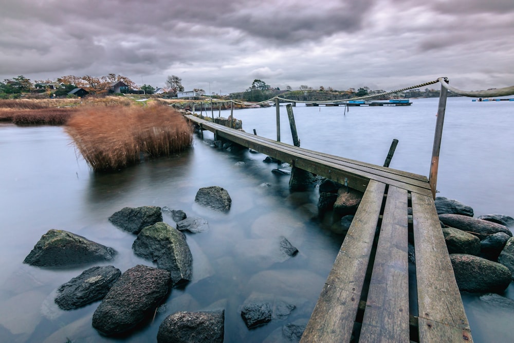 a long wooden bridge over a body of water