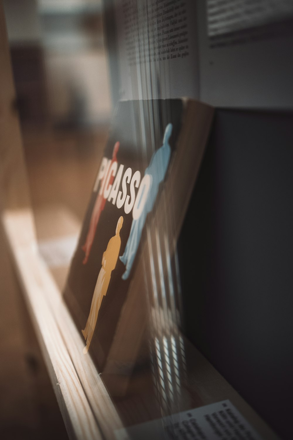 a book sitting on top of a wooden shelf